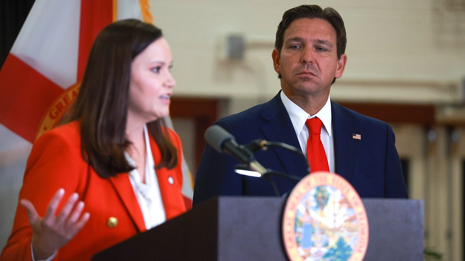 Ashley Moody and Ron DeSantis during media presser