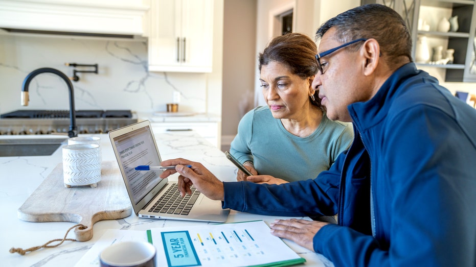 A woman and financial advisor at home.