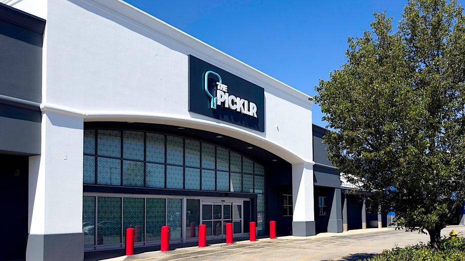 A building with The Picklr sign, the world’s largest pickleball franchise