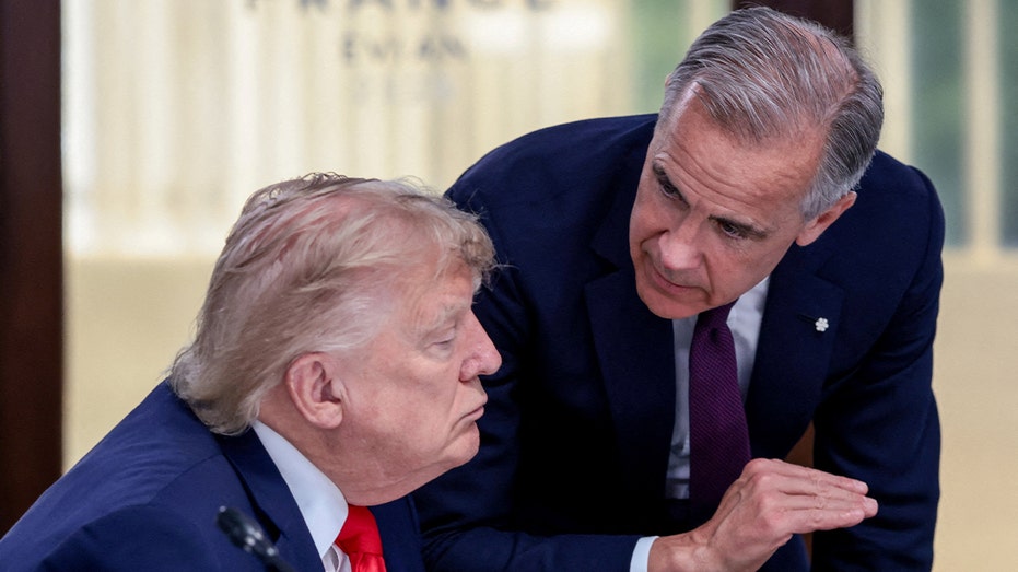U.S. President Donald Trump speaks with Canadian Prime Minister Mark Carney at a working lunch with leaders of G7 and the Middle East, in Evian-les-Bains, France, June 16, 2026.