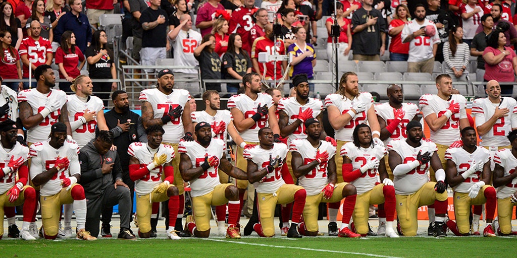 More than 200 NFL players sit or kneel during anthem