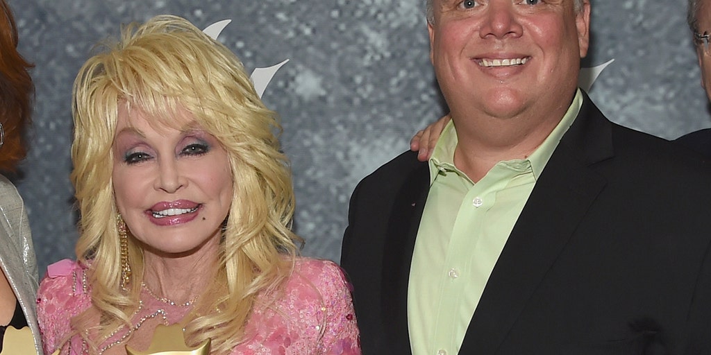 Dolly Parton Sex Videos Coming - Dolly Parton called out by sister for posing with axed publicist Kirt  Webster at CMA Awards