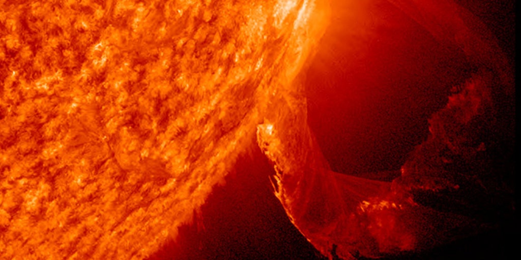 Solar flare: A magnetic eruption on the Sun blows off a towering spire of  plasma.