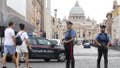Carabinieri (Italian paramilitary police) officers patrol the area in front of St. Peter's Basilica, visible in background, in Rome, Friday, Aug. 5, 2016.