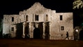 FILE - In this March 6, 2013, file photo, John Potter, a member of the San Antonio Living History Association, patrols the Alamo in San Antonio, during a pre-dawn memorial ceremony to remember the 1836 Battle of the Alamo and those who fell on both sides.