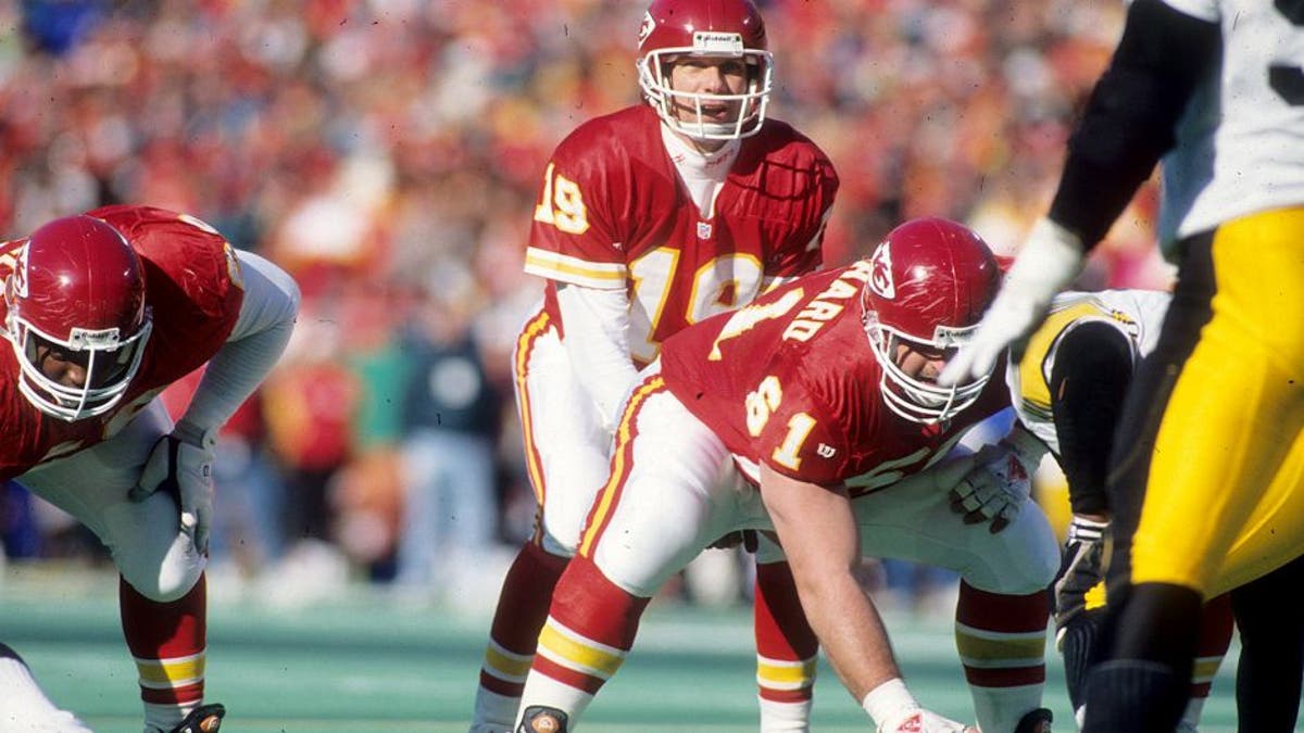 KANSAS CITY, MO - JANUARY 8: Quarterback Joe Montana #19 of the Kansas City Chiefs prepares to take the snap from center Tim Grunhard #61 against the Pittsburgh Steelers in the 1993 AFC Wild Card Game at Arrowhead Stadium on January 8, 1994 in Kansas City, Missouri. The Chiefs defeated the Steelers 27-24 in overtime. (Photo by Joseph Patronite/Getty Images)