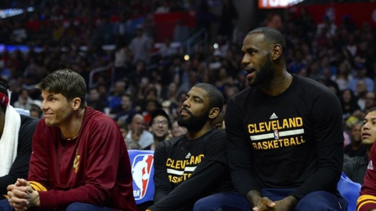 LOS ANGELES, CA - MARCH 18: (left to right) Kyle Korver #26, Kyrie Irving #2 and Lebron James #23 of the Cleveland Cavaliers sitting out the game against the Los Angeles Clippers on March 18, 2017 at STAPLES Center in Los Angeles, California. NOTE TO USER: User expressly acknowledges and agrees that, by downloading and or using this photograph, User is consenting to the terms and conditions of the Getty Images License Agreement. (Photo by Robert Laberge/Getty Images)