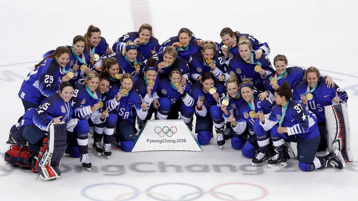 Untied States hockey team celebrate with their gold medals after beating Canada in the women's gold medal hockey game at the 2018 Winter Olympics in Gangneung, South Korea, Thursday, Feb. 22, 2018. (AP Photo/Matt Slocum)