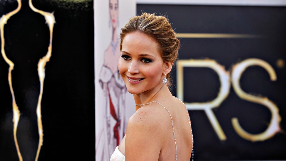 Jennifer Lawrence arrives at the 85th annual Academy Awards. 