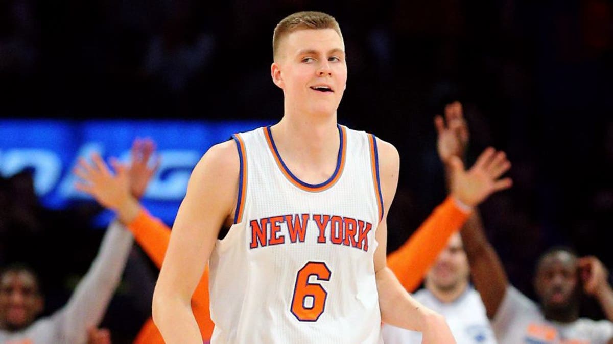 Jan 10, 2016; New York, NY, USA; New York Knicks power forward Kristaps Porzingis (6) reacts after hitting an off balance three point shot as the shot clock expired against the Milwaukee Bucks during the fourth quarter at Madison Square Garden. The Knicks defeated the Bucks 100-88. Mandatory Credit: Brad Penner-USA TODAY Sports