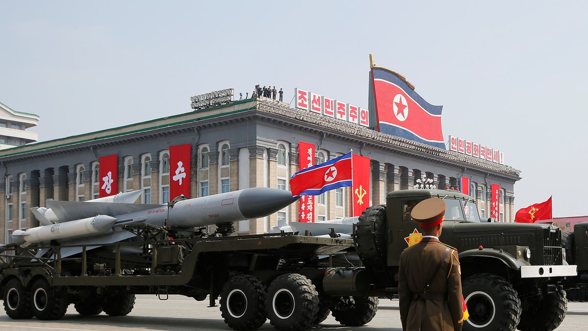 Missiles are driven past the stand with North Korean leader Kim Jong Un and other high ranking officials during a military parade marking the 105th birth anniversary of North Korea's founding father, Kim Il Sung, in Pyongyang, April 15, 2017. REUTERS/Sue-Lin Wong - RTS12FMQ