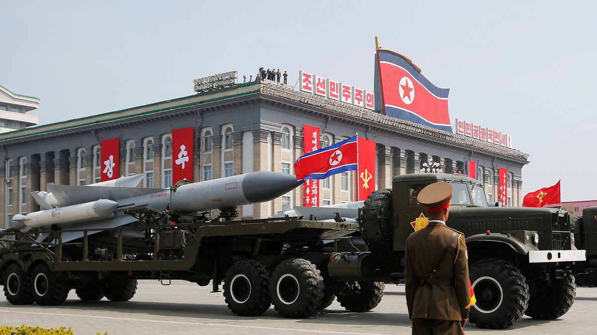 Missiles are driven past the stand with North Korean leader Kim Jong Un and other high ranking officials during a military parade marking the 105th birth anniversary of North Korea's founding father, Kim Il Sung, in Pyongyang, April 15, 2017. REUTERS/Sue-Lin Wong - RTS12FMQ