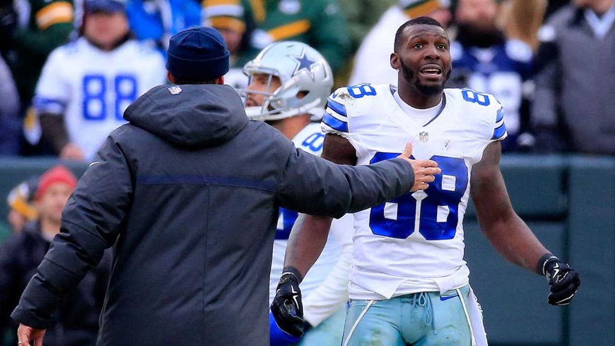 <p>GREEN BAY, WI - JANUARY 11: Dez Bryant #88 of the Dallas Cowboys waits for a replay on a call late in the fourth quarter against the Green Bay Packers during the 2015 NFC Divisional Playoff game at Lambeau Field on January 11, 2015 in Green Bay, Wisconsin. (Photo by Rob Carr/Getty Images)</p>