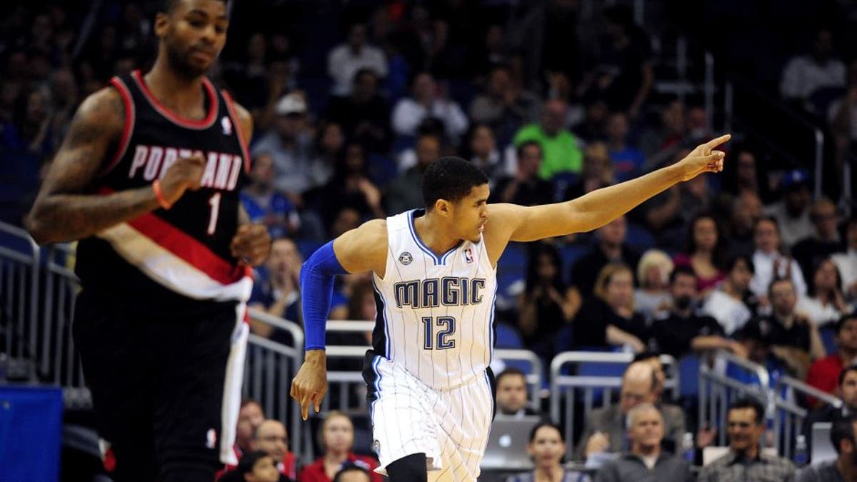 Mar 25, 2014; Orlando, FL, USA; Orlando Magic forward Tobias Harris (12) celebrates after hitting a three-point basket in the second half as the Orlando Magic beat the Portland Trail Blazers 95-85 at Amway Center. Harris scored a game-high 25 points. Mandatory Credit: David Manning-USA TODAY Sports