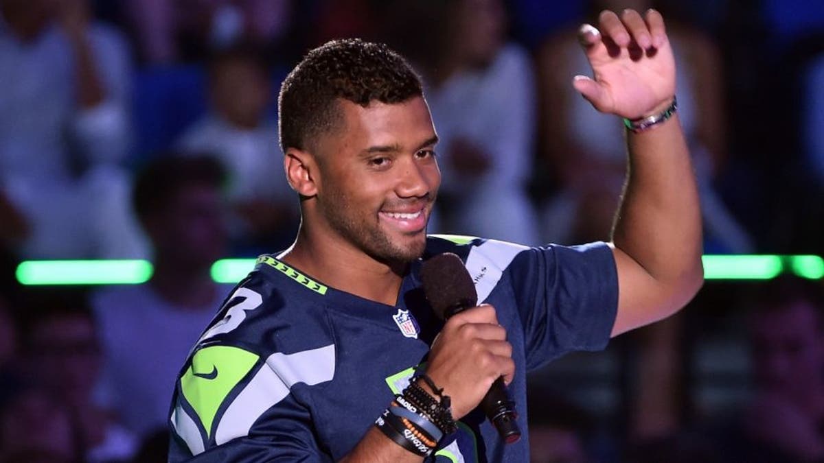 WESTWOOD, CA - JULY 16: Host Russell Wilson speaks onstage at the Nickelodeon Kids' Choice Sports Awards 2015 at UCLA's Pauley Pavilion on July 16, 2015 in Westwood, California. (Photo by Kevin Winter/Getty Images)