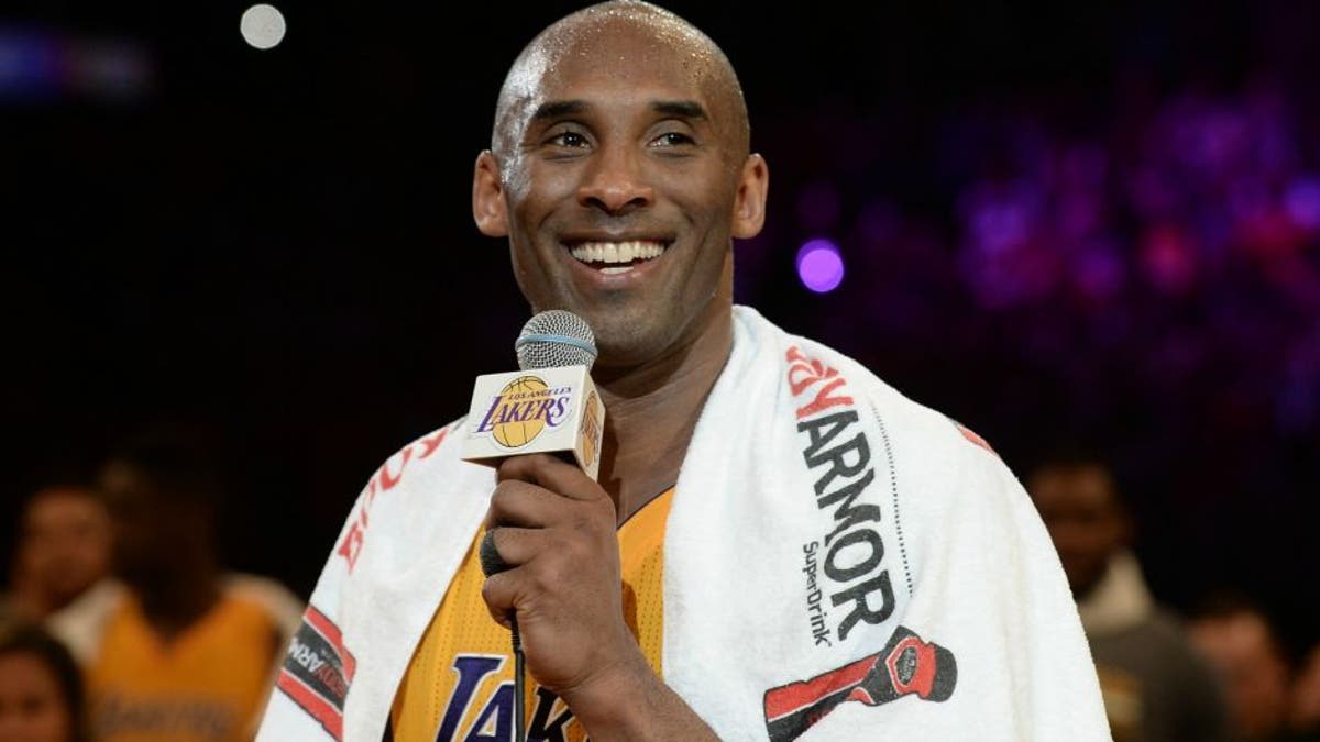 Apr 13, 2016; Los Angeles, CA, USA; Los Angeles Lakers forward Kobe Bryant (24) smiles as he addresses the crowd after the Lakers defeat of the Utah Jazz in the final game of his career at Staples Center. Mandatory Credit: Robert Hanashiro-USA TODAY Sports