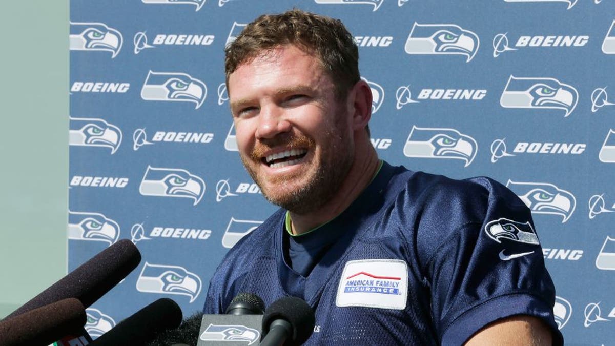 U.S. Army veteran and former Texas long snapper Nate Boyer talks to reporters after Seattle Seahawks minicamp.