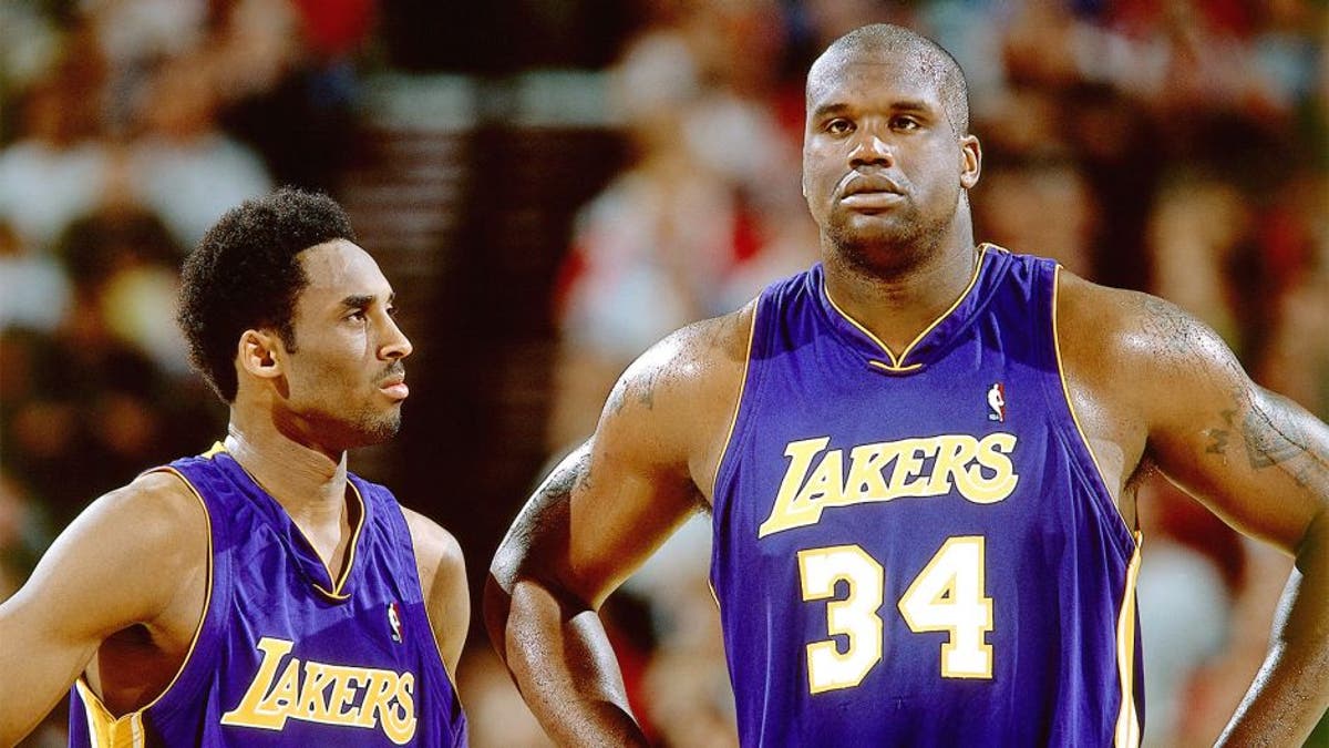 2001: Kobe Bryant #8 and Shaquille O'Neal #34 of the Los Angeles Lakers look on during an NBA game circa 2001. NOTE TO USER: User expressly acknowledges and agrees that, by downloading and/or using this Photograph, User is consenting to the terms and conditions of the Getty Images License Agreement. Mandatory Copyright Notice: Copyright 2001 NBAE (Photo by Sam Forencich/NBAE via Getty Images)