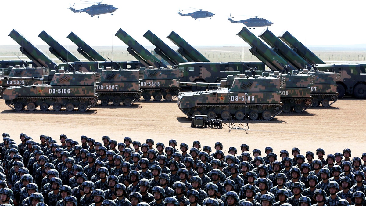 Soldiers of China's People's Liberation Army (PLA) take part in a military parade to commemorate the 90th anniversary of the foundation of the army at the Zhurihe military training base in Inner Mongolia Autonomous Region, China, July 30, 2017. REUTERS/Stringer ATTENTION EDITORS - THIS IMAGE WAS PROVIDED BY A THIRD PARTY. CHINA OUT. NO COMMERCIAL OR EDITORIAL SALES IN CHINA. - RTS19PP2