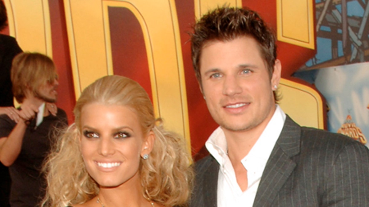 Presenter Jessica Simpson and her husband, Nick Lachey arrive for the MTV Movie Awards on Saturday, June 4, 2005, in Los Angeles. (AP Photo/Chris Pizzello)