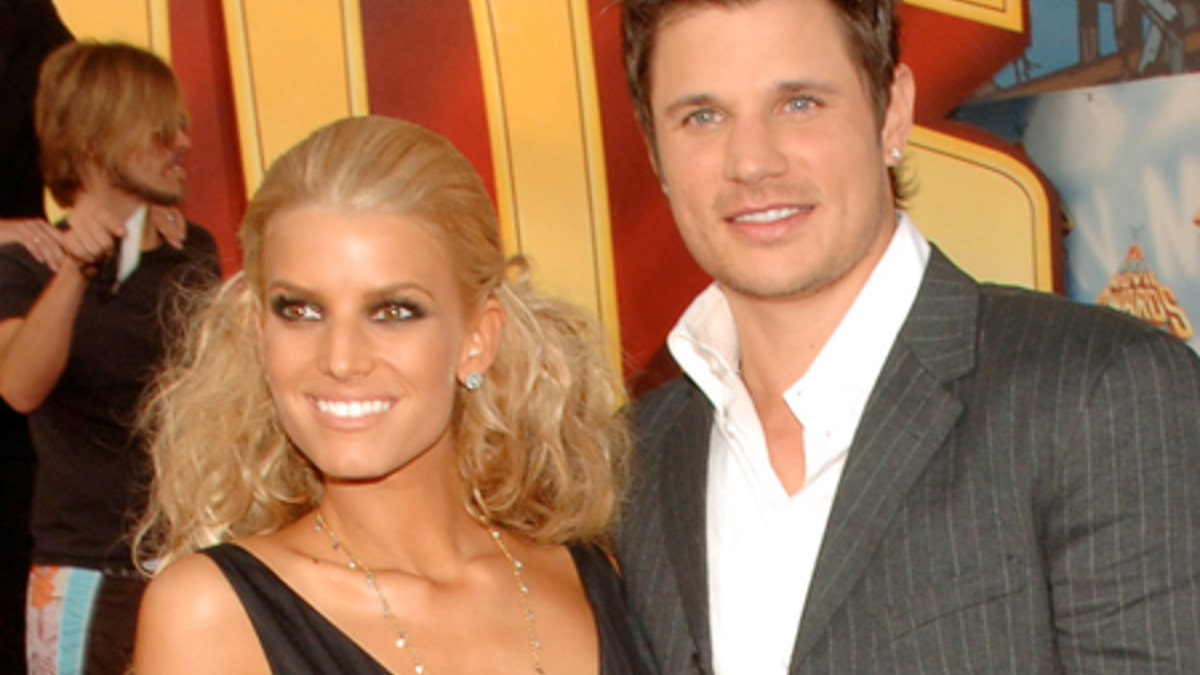 Presenter Jessica Simpson and her husband, Nick Lachey arrive for the MTV Movie Awards on Saturday, June 4, 2005, in Los Angeles. (AP Photo/Chris Pizzello)