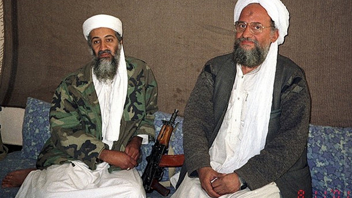 Nov. 10, 2001: Usama bin Laden sits with his adviser and purported successor Ayman al-Zawahiri, an Egyptian linked to the Al Qaeda network, during an interview with Pakistani journalist Hamid Mir (not pictured) in an <a href='https://chatgptimage.xyz/privacy-and-policy' target='_blank'>image</a> supplied by the respected Dawn newspaper.