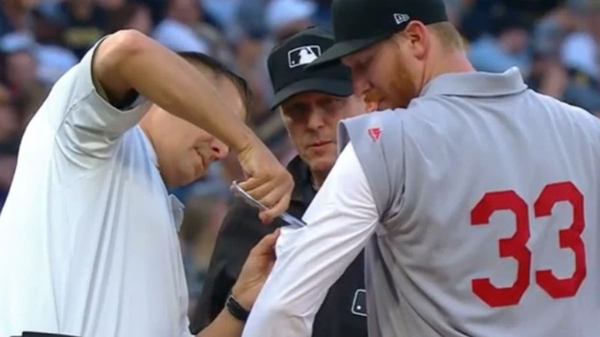 Cubs' wild win features a controversial review, an ejection