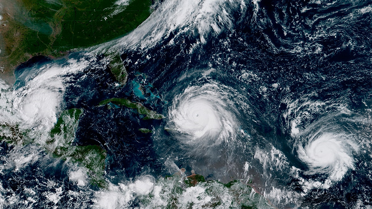 In this GOES-16 geocolor image satellite image taken Thursday, Sept. 7, 2017, the eye of Hurricane Irma, center, is just north of the island of Hispaniola, with Hurricane Katia, left, in the Gulf of Mexico, and Hurricane Jose, right, in the Atlantic Ocean. Irma, a fearsome Category 5 storm, cut a path of devastation across the northern Caribbean, leaving at least 10 dead and thousands homeless after destroying buildings and uprooting trees on a track Thursday that could lead to a catastrophic strike on Florida. (NOAA via AP)