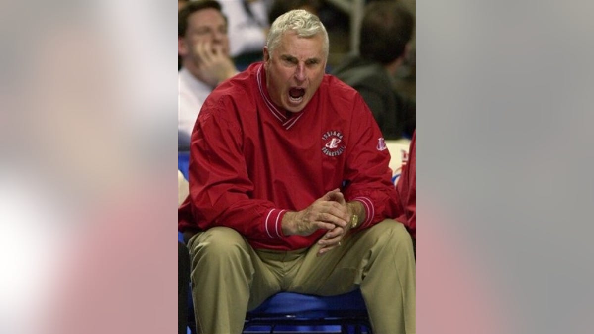 FILE - In this March 17, 2000, file photo, former Indiana head coach Bobby Knight screams at his players during the waning minutes of their team's 77-57 loss to Pepperdine in the first round of the East Regionals of the NCAA college men's basketball tournament at the HSBC Arena in Buffalo, N.Y. Knight will be inducted into Indiana University's athletics Hall of Fame nearly a decade after he was fired for violating a zero-tolerance policy imposed by then-IU President Myles Brand.(AP Photo/Elise Amendola, File)