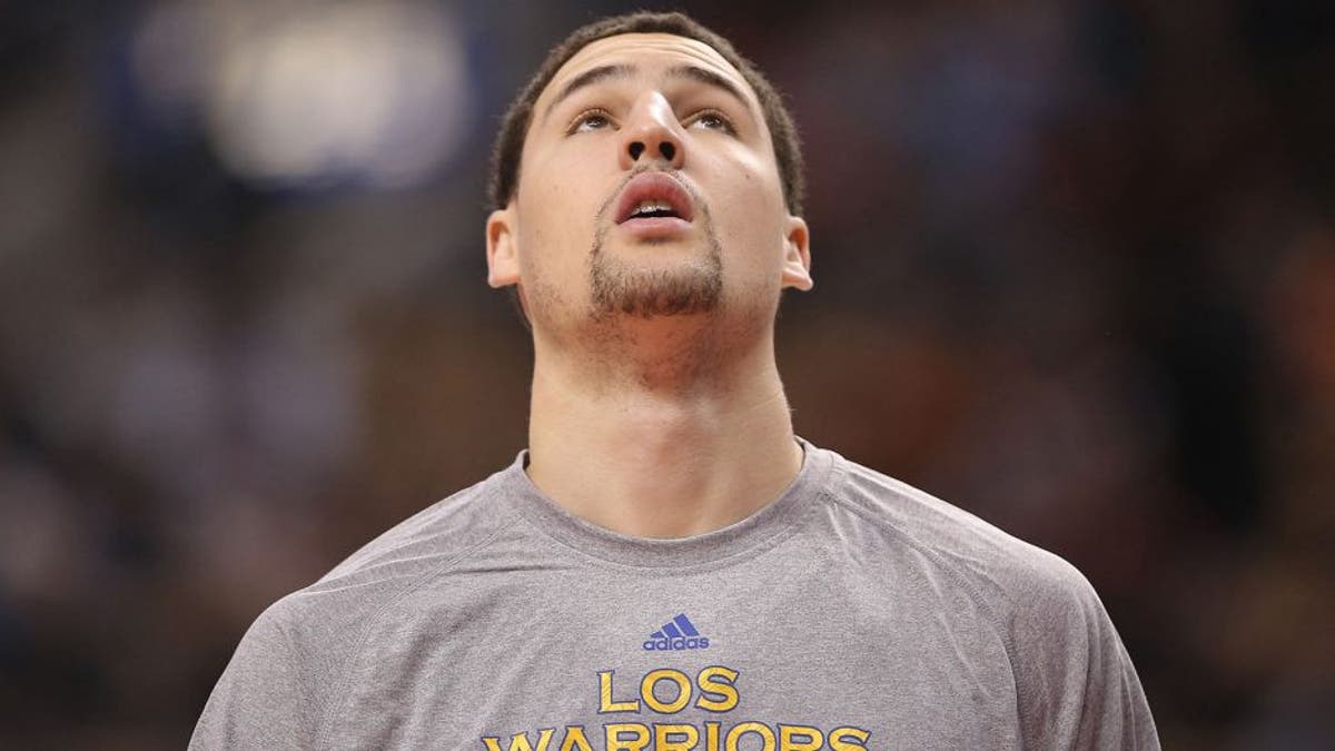 Mar 2, 2014; Toronto, Ontario, CAN; Golden State Warriors guard Klay Thompson (11) warms up before the start of their game against the Toronto Raptors at Air Canada Centre. The Raptors beat the Warriors 104-98. Mandatory Credit: Tom Szczerbowski-USA TODAY Sports
