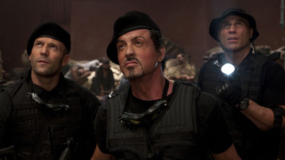 In this film publicity image released by Lionsgate Entertainment, from left, Jason Statham, Sylvester Stallone and Randy Couture are shown in a scene from 