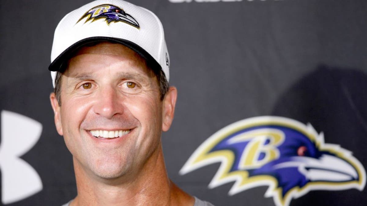 Baltimore Ravens head coach John Harbaugh speaks with members of the media after a joint practice with the Philadelphia Eagles at the Eagle's NFL football training camp, Wednesday, Aug. 19, 2015, in Philadelphia. (AP Photo/Matt Rourke)