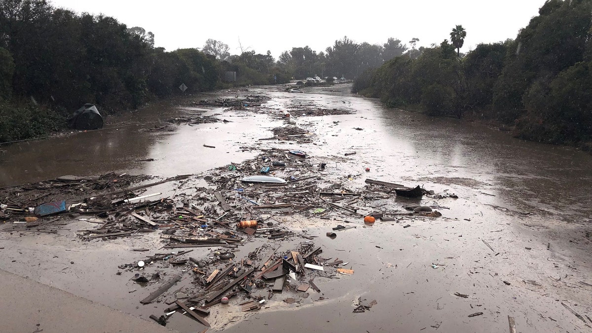 Debris floats in flooded waters on the freeway after a mudslide in Montecito, California, U.S. in this photo provided by the Santa Barbara County Fire Department, January 9, 2018.   Mike Eliason/Santa Barbara County Fire Department/Handout via REUTERS     ATTENTION EDITORS - THIS IMAGE WAS PROVIDED BY A THIRD PARTY. - RC1EF9605DF0