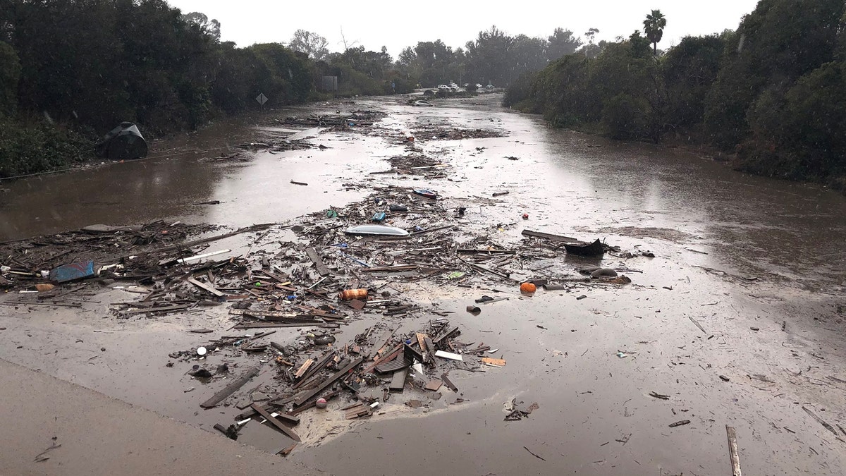 Debris floats in flooded waters on the freeway after a mudslide in Montecito, California, U.S. in this photo provided by the Santa Barbara County Fire Department, January 9, 2018.   Mike Eliason/Santa Barbara County Fire Department/Handout via REUTERS     ATTENTION EDITORS - THIS IMAGE WAS PROVIDED BY A THIRD PARTY. - RC1EF9605DF0