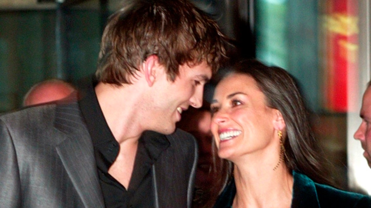 Actress Demi Moore and her boyfriend actor Ashton Kutcher arrive at aspecial screening of the film 
