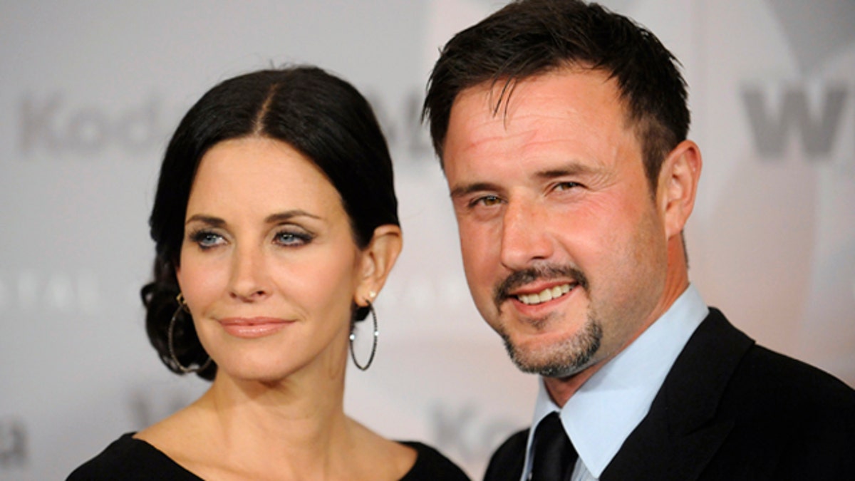 Actors Courteney Cox and her husband David Arquette attend the 2010 Women in Film Crystal+Lucy Awards in Los Angeles June 1, 2010. REUTERS/Phil McCarten (UNITED STATES - Tags: ENTERTAINMENT PROFILE)