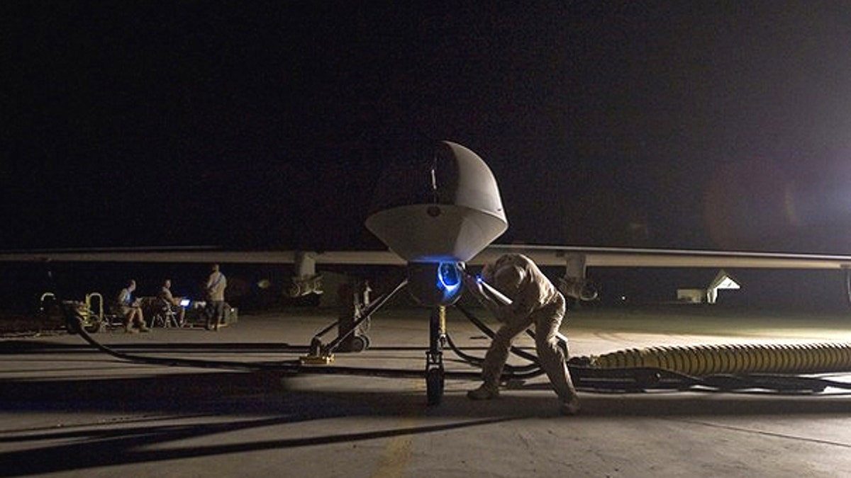A pre-flight inspection of an MQ-1B Predator unmanned drone aircraft.