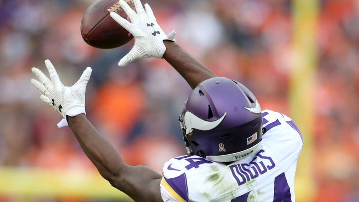 Oct 4, 2015; Denver, CO, USA; Minnesota Vikings wide receiver Stefon Diggs (14) catches a pass during the second half against the Denver Broncos at Sports Authority Field at Mile High. The Broncos won 23-20. Mandatory Credit: Chris Humphreys-USA TODAY Sports