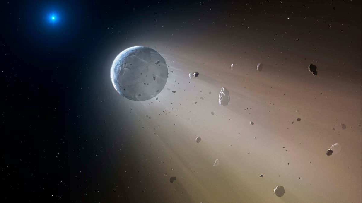 This artist's rendering provided by the Harvard-Smithsonian Center for Astrophysics shows an asteroid slowly disintegrating as it orbits a white dwarf star.