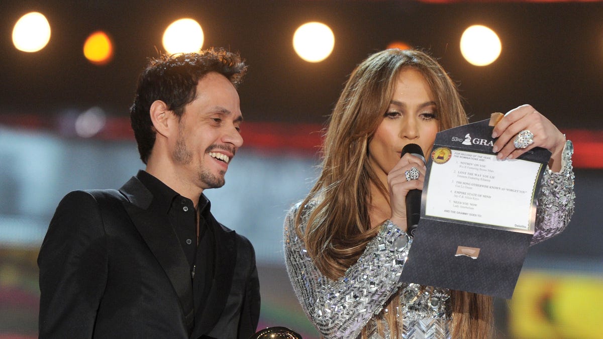 LOS ANGELES, CA - FEBRUARY 13:  Singer Marc Anthony and actress Jennifer Lopez speak onstage during The 53rd Annual GRAMMY Awards held at Staples Center on February 13, 2011 in Los Angeles, California.  (Photo by Kevin Winter/Getty Images)