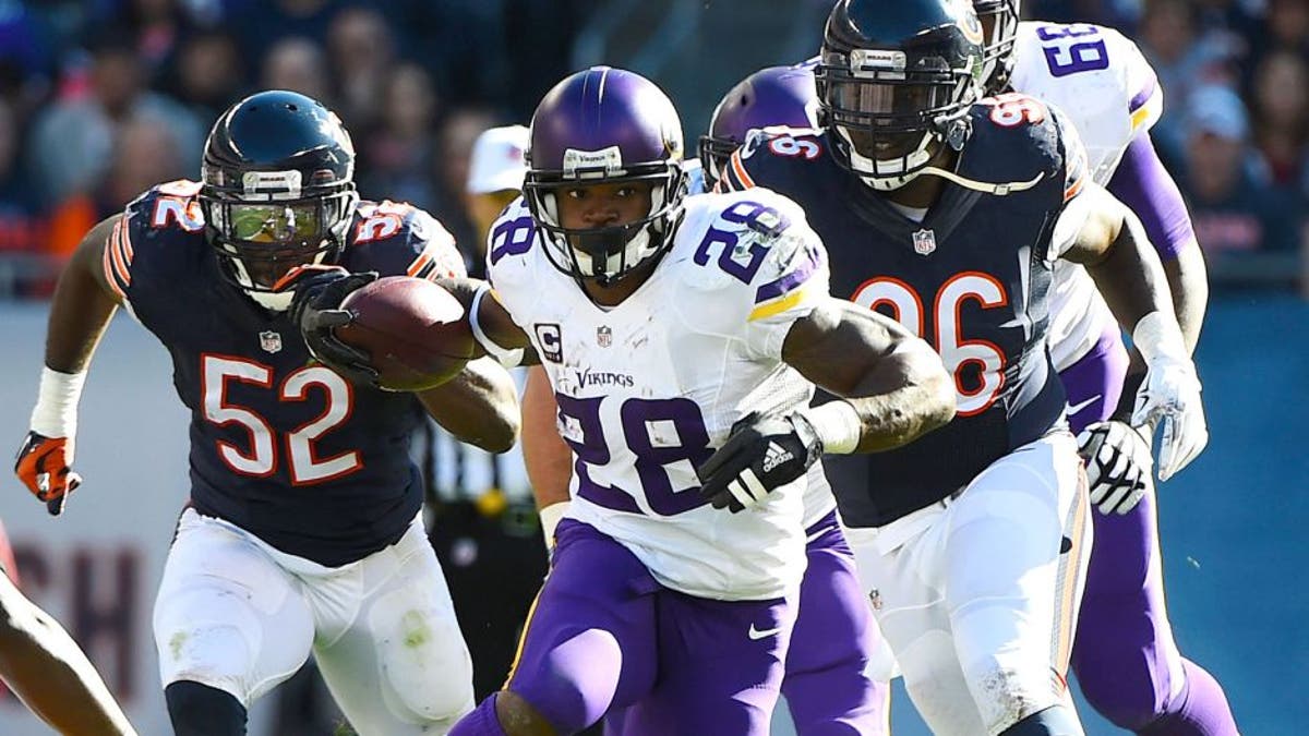 Nov 1, 2015; Chicago, IL, USA; Minnesota Vikings running back Adrian Peterson (28) carries the ball against the Chicago Bears during the first half at Soldier Field. Mandatory Credit: Mike DiNovo-USA TODAY Sports