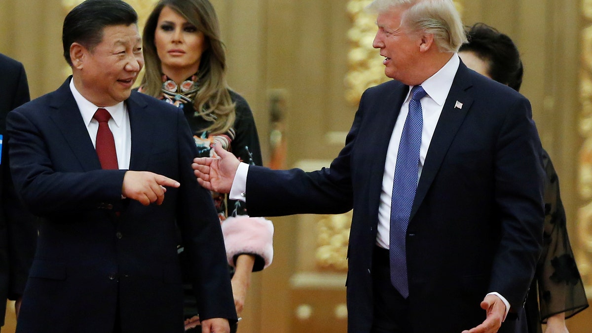 U.S. President Donald Trump and China's President Xi Jinping arrive at a state dinner at the Great Hall of the People in Beijing, China, November 9, 2017. REUTERS/Thomas Peter - RC1171507BF0