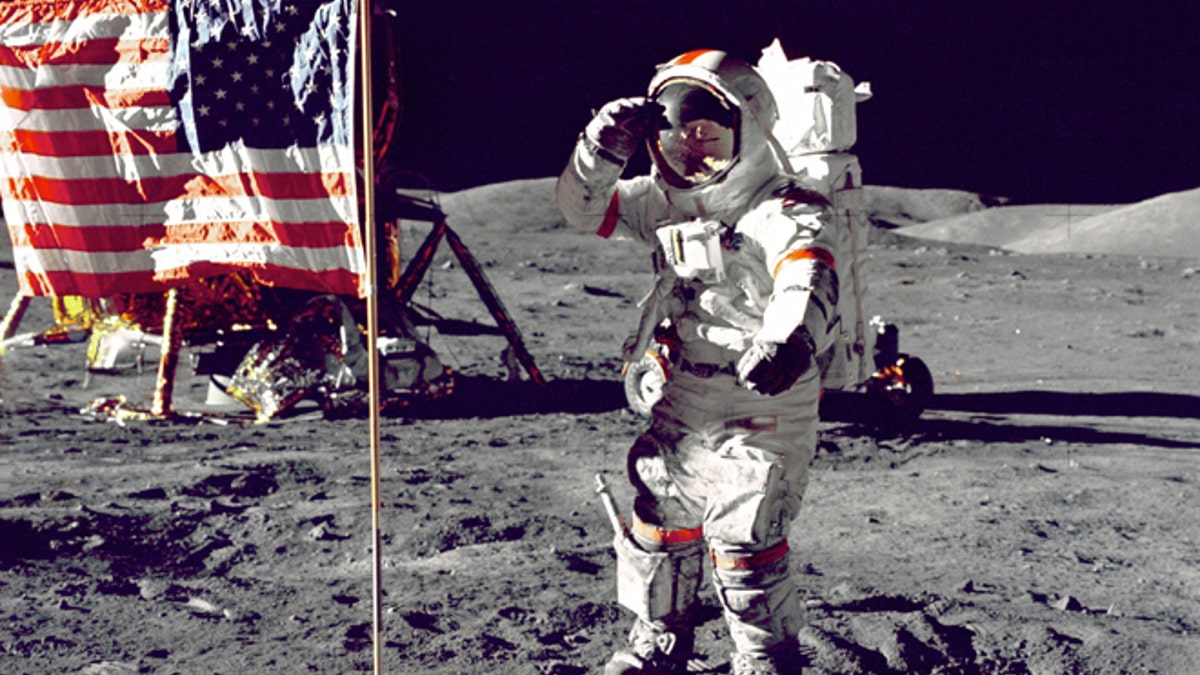 Eugene Cernan salutes the American flag during the Apollo 17 mission in 1972.