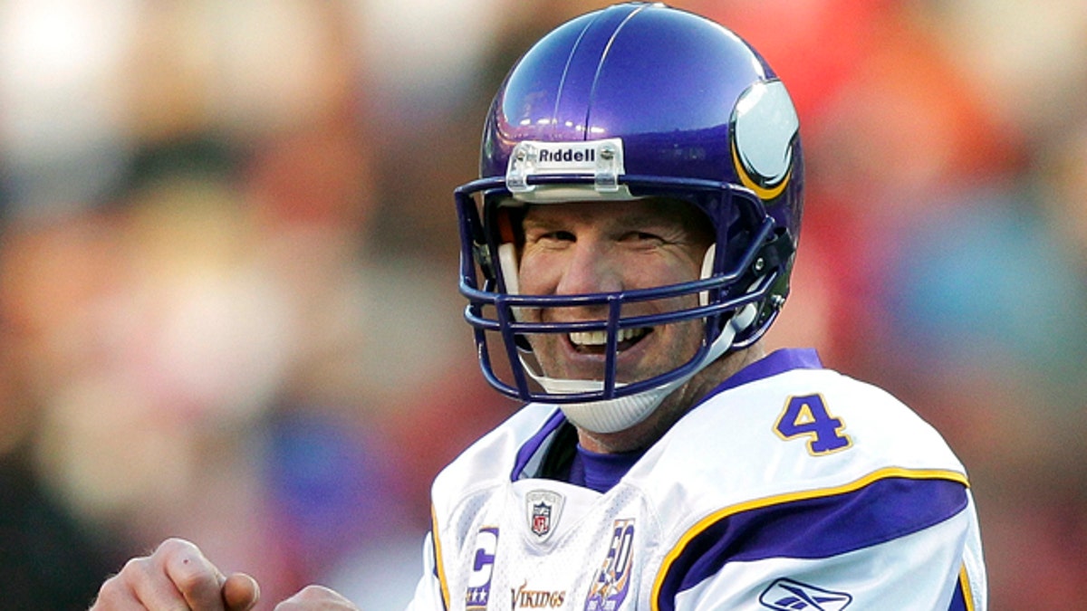 Minnesota Vikings quarterback Brett Favre celebrates his scramble for a first down during the second half of an NFL football game against the Washington Redskins in Landover, Md., Sunday, Nov. 28, 2010. The Vikings won 17-13. (AP Photo/Pablo Martinez Monsivais)