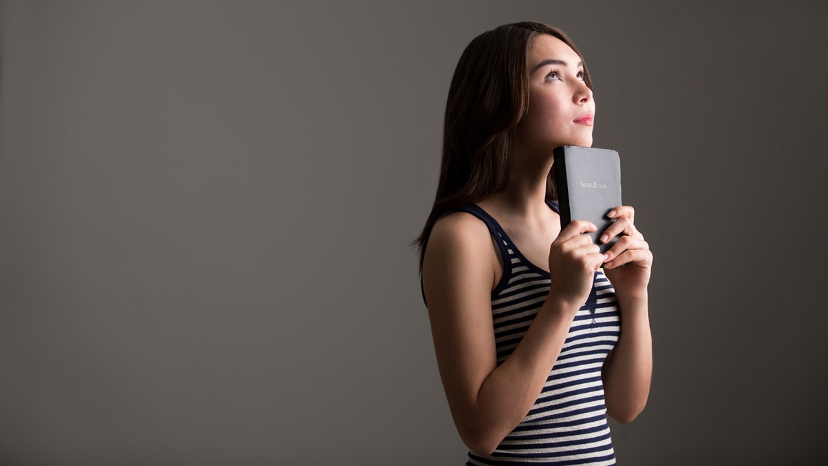 Woman with Bible iStock