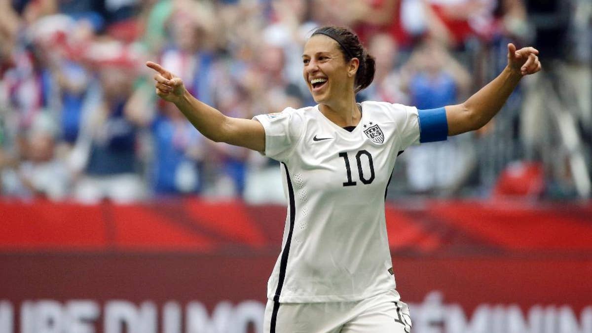 FILE - In this July 5, 2015, file photo, Carli Lloyd of the U.S celebrates scoring her third goal against Japan during the first half of the FIFA Women's World Cup soccer championship in Vancouver, British Columbia, Canada. After spending her entire career playing for clubs in her homeland, the United States captain signed Wednesday, Feb. 15, 2017 to play for women's champion Manchester City this spring. (AP Photo/Elaine Thompson, File)