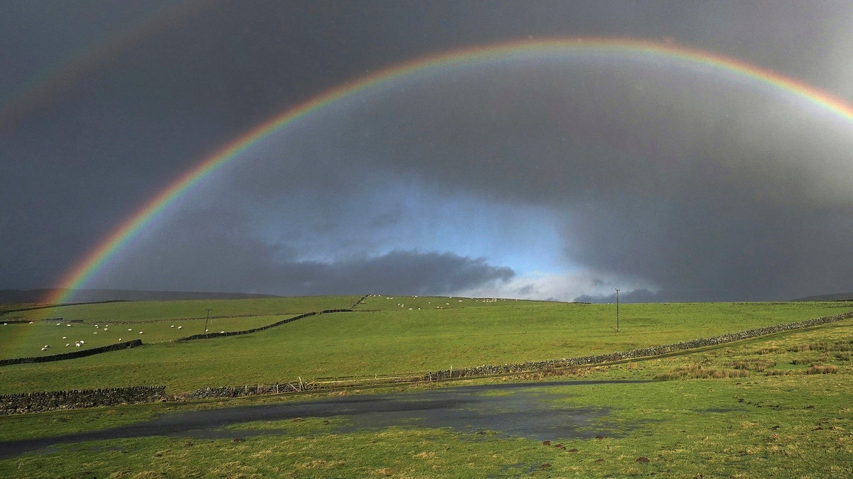 A rainbow appears in the sky over fields near Middleton-in-Teesdale in north England, Thursday Nov. 23, 2017. (Owen Humphreys/PA via AP)