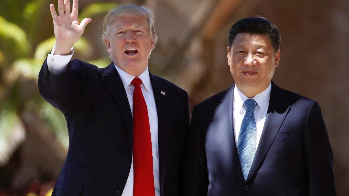 FILE - In this Friday, April 7, 2017, file photo, U.S. President Donald Trump, left, and Chinese President Xi Jinping pause for photographs at Mar-a-Lago in Palm Beach, Fla. North Korea often marks significant dates by displaying military capability, and South Korean officials say there's a chance the country will conduct its sixth nuclear test or its maiden test launch of an ICBM around the founding anniversary of its military on Tuesday, April 25. Trump spoke by phone with both the Japanese and Chinese leaders Monday, April 24. China's official broadcaster CCTV quoted Xi telling Trump that China strongly opposed North Korea's nuclear weapons program and hoped 