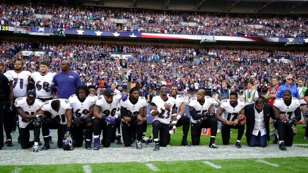 players kneeling AP