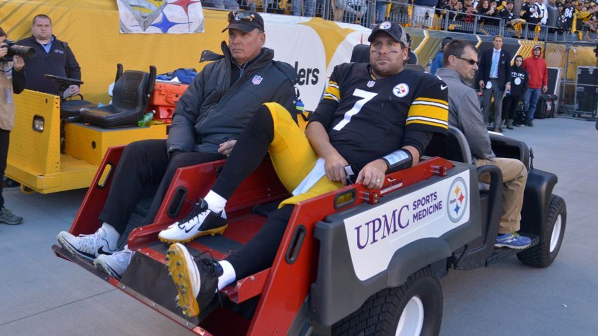 Pittsburgh Steelers quarterback Ben Roethlisberger (7) is taken away on a  cart after being injured in